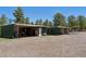 Three green animal shelters with covered areas and gravel ground at 1044 S Grapevine Rd, Golden, CO 80401
