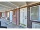 Brick building exterior showcasing multiple entrances and landscaping at 1180 Yosemite St # 110, Denver, CO 80220