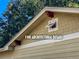 Architectural detail of the roofline with a small window at 1501 S Garfield St, Denver, CO 80210