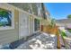 Townhouse entrance with private patio and landscaping at 6885 E Arizona Avenue # D, Denver, CO 80224