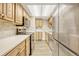 Modern kitchen with stainless steel appliances and light wood cabinets at 6885 E Arizona Avenue # D, Denver, CO 80224