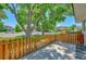 Private patio area with wood fence and street view at 6885 E Arizona Avenue # D, Denver, CO 80224