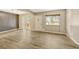 Spacious living room with wood-look floors and access to a patio at 6885 E Arizona Avenue # D, Denver, CO 80224