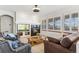 Living room with a fireplace and access to kitchen at 8129 S Algonquian Cir, Aurora, CO 80016