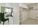 Spacious walk-in closet with built-in shelving and ample storage space at 4213 Sandstone Dr, Mead, CO 80504