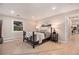 Bright bedroom with large window and wood floors at 2395 W Davies Ave, Littleton, CO 80120