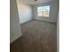 Bright bedroom with neutral carpeting and a window at 24752 E Atlantic Dr, Aurora, CO 80018