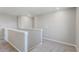 Upstairs hallway with neutral carpeting and painted walls at 18097 Dandy Brush Ln, Parker, CO 80134