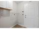 Bright laundry room with built-in shelving and cabinets at 9396 Garfield St, Thornton, CO 80229