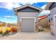 Detached garage with stone accents at 17630 W 94Th Dr, Arvada, CO 80007