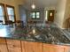 Open kitchen with granite countertops and island at 7202 S Mount Holy Cross, Littleton, CO 80127