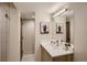 Bathroom with a vanity and a large mirror at 2313 S High St, Denver, CO 80210
