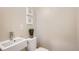 Small bathroom with toilet and sink at 2313 S High St, Denver, CO 80210