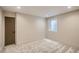 Spacious basement bedroom with carpeted floors and a window at 2313 S High St, Denver, CO 80210