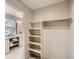 Spacious walk-in closet with shelving and hanging rod at 2313 S High St, Denver, CO 80210