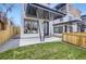 Modern home exterior with covered patio and landscaped lawn at 2313 S High St, Denver, CO 80210
