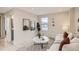Cozy living room featuring a comfortable sofa and large windows at 2313 S High St, Denver, CO 80210