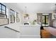 Elegant stairwell with a modern light fixture and window views at 655 N Humboldt St, Denver, CO 80218