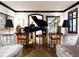 Spacious living room with grand piano, ornate mirrors, and plush seating at 727 N Washington St, Denver, CO 80203