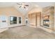 Living room with corner fireplace and built-in shelving at 645 Coyote Trl, Elizabeth, CO 80107