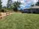Landscaped backyard with large grassy area at 7000 S Sheridan Blvd, Littleton, CO 80128