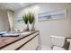 Clean bathroom with granite countertop and large mirror at 7000 S Sheridan Blvd, Littleton, CO 80128