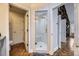Main bathroom with walk-in shower and herringbone wood floors at 7000 S Sheridan Blvd, Littleton, CO 80128