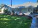 House front with landscaping and driveway at 7000 S Sheridan Blvd, Littleton, CO 80128