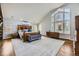 Spacious main bedroom with high ceilings, large windows, and hardwood floors at 7000 S Sheridan Blvd, Littleton, CO 80128
