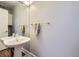 Powder room features pedestal sink and classic design at 7000 S Sheridan Blvd, Littleton, CO 80128