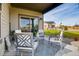 Relaxing covered patio with seating area, perfect for outdoor enjoyment at 830 W 128Th Pl, Westminster, CO 80234