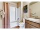 Clean bathroom with shower/tub combo and neutral color palette at 830 W 128Th Pl, Westminster, CO 80234