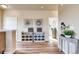 Inviting entryway with decorative storage and hardwood floors at 830 W 128Th Pl, Westminster, CO 80234