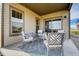Covered patio features comfortable seating and a view of the backyard at 830 W 128Th Pl, Westminster, CO 80234