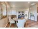 Small dining area with a round wooden table and seating for four at 830 W 128Th Pl, Westminster, CO 80234