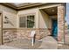 Charming home exterior with stone accents and teal door at 830 W 128Th Pl, Westminster, CO 80234