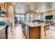 Open concept kitchen with island and granite countertops at 830 W 128Th Pl, Westminster, CO 80234