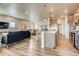 Open concept kitchen with island and stainless steel appliances at 830 W 128Th Pl, Westminster, CO 80234