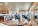 Open concept kitchen with island and adjacent dining area at 830 W 128Th Pl, Westminster, CO 80234