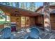 Spacious deck with mountain views, chairs, and a grill at 28192 Shadow Mountain Dr, Conifer, CO 80433