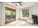 Bedroom with sliding glass doors leading to a deck and a view of the trees at 28192 Shadow Mountain Dr, Conifer, CO 80433