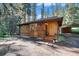 Charming wooden home with a spacious front yard at 28192 Shadow Mountain Dr, Conifer, CO 80433