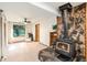 Cozy living area with a wood-burning stove and access to the outdoors at 28192 Shadow Mountain Dr, Conifer, CO 80433