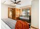 Bright bedroom with a crib, built-in closet, and a view at 28192 Shadow Mountain Dr, Conifer, CO 80433