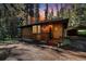 Rustic home exterior with wood siding and stone steps at 28192 Shadow Mountain Dr, Conifer, CO 80433