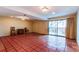 Finished basement with tiled floors and sliding glass door to patio at 62 S Holman Way # 62, Golden, CO 80401