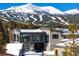 Modern home exterior with mountain views in winter at 132 N Gold Flake Ter, Breckenridge, CO 80424