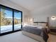 Bedroom with mountain views and sliding glass doors at 132 N Gold Flake Ter, Breckenridge, CO 80424