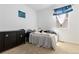 Bright bedroom with double bed and dresser at 9785 Mount Kataka Pt, Littleton, CO 80125