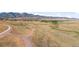 Open space with walking paths and mountain backdrop at 9785 Mount Kataka Pt, Littleton, CO 80125